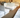 Dormitory-style homeless shelter with multiple beds providing safe housing for residents