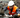 Factory worker in safety vest and hard hat operating heavy machinery in a manufacturing plant