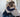 Two women hugging in a support group session, symbolizing encouragement and recovery in addiction treatment